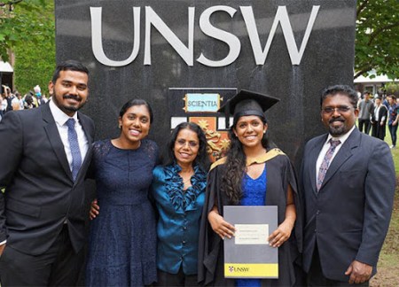 Graduating woman and family